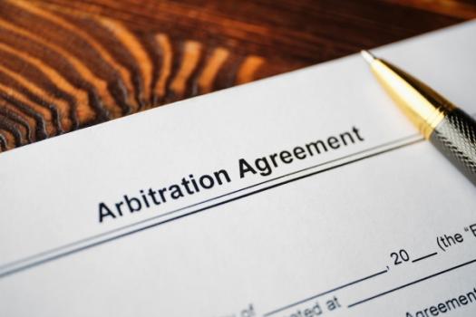 Arbitration Provision Must Be Incorporated into a Bond for Surety to Elect Arbitration Pen lying on arbitration agreement