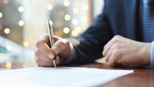 Read Before You Sign: Claim Waivers in Project Documents Business person signing document
