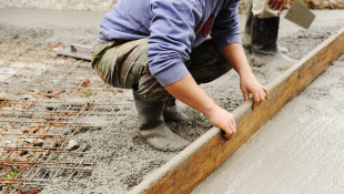 A Primer on Suspension and Debarment for Federal Construction Projects Construction workers building foundation
