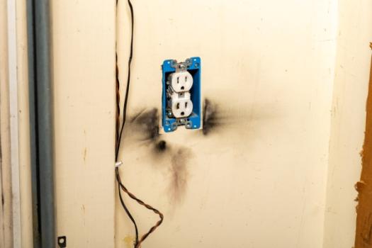 Subrogation Insight: Expert Testimony Admissible Despite Post-Loss Repairs Burnt wall outlet from fire
