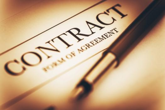 Construction and Design Contracts—They Are More Important Than You Might Think! (Law Note) Pen lying on Contract