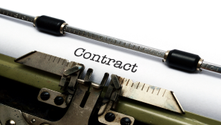 COVID-19 Likely No Longer Covered Under Force Majeure Contract in typewriter