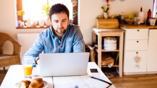 Businessman working from home on laptop