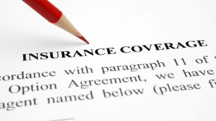 Red pencil on Insurance coverage document