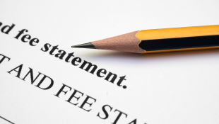 Pencil resting on fee statement