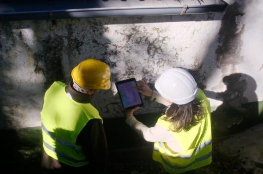 Workers inspecting damage