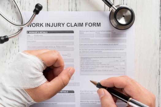 Person filling out a work injury report