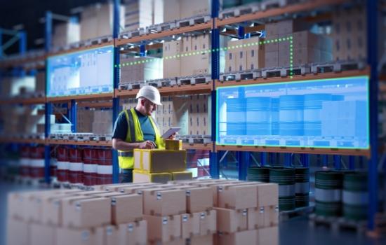Worker in warehouse full of supplies
