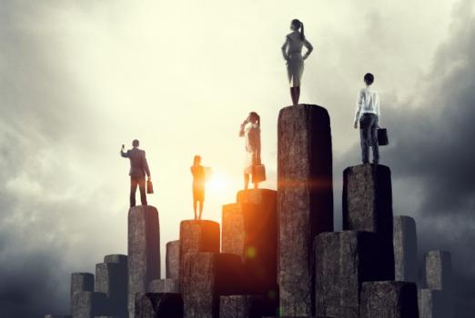 Business people standing on pedestals