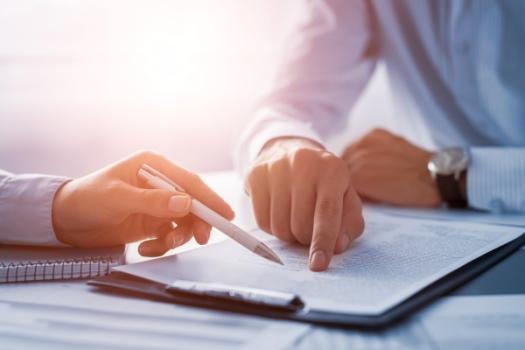 Person pointing at contract
