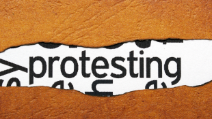 Contractors Pay Heed: The Federal Circuit Clarifies Two Important Issues For Bid Protestors Protesting text on ripped paper