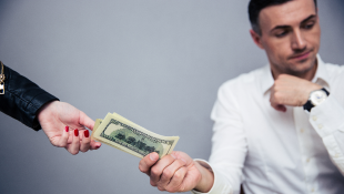 Businessman giving cash to someone