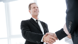 Two business people shaking hands