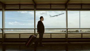 Businessman traveling through airport