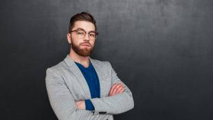 Potential Construction Liabilities Contractors Need to Know Businessman with his arms folded