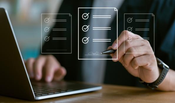Person signing contract on computer
