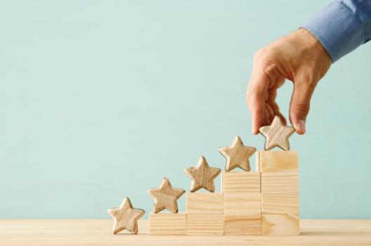Hand adding fifth star