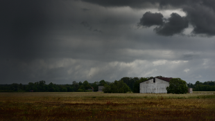 Before and After the Storm: Know Your Insurance Rights, Coverages and Obligations Dark storm clouds over rural plain