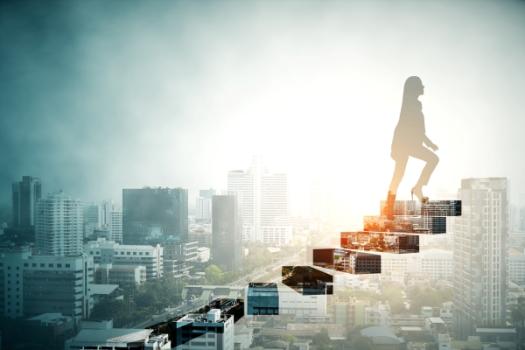 Woman walking up steps in sky