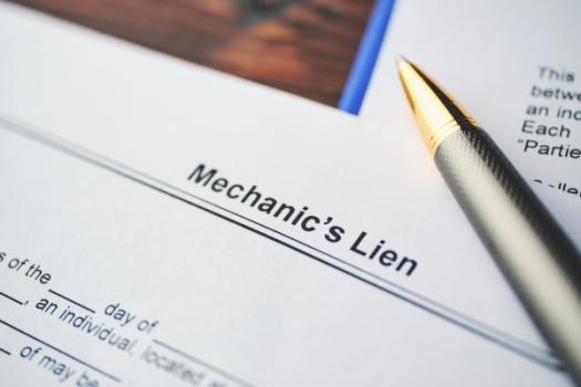 Pen lying on Mechanics Lien document