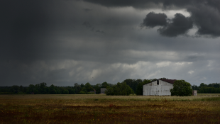 Dark storm clouds above rural area