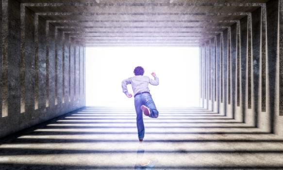 Man running through tunnel