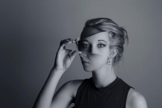 If We Want Affordable Housing, Local Governments Must Look in the Mirror Woman holding mirror distortion