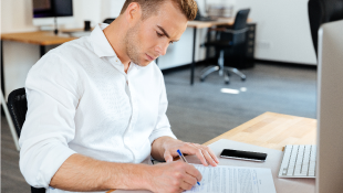 Businessman signing document