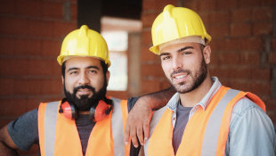 Two construction workers posing