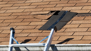 Fixing damaged roof shingle