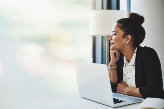 Business woman happy in front of laptop