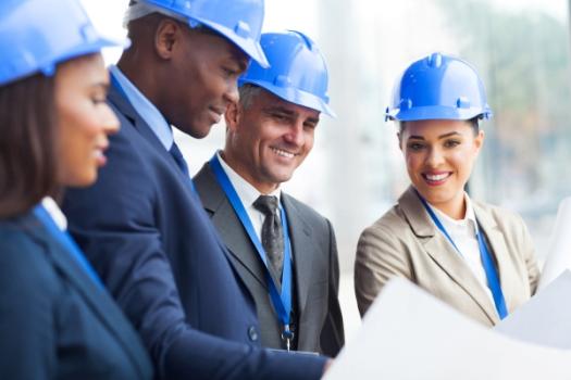 McKinsey Finds Rising Infrastructure Appeal Among Private Investors Businesspeople in hardhats meeting