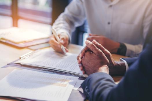 Anti-Concurrent Causation Clause Defeats Coverage Two people meeting over contract
